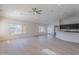 Open-concept living area featuring hardwood floors, recessed lighting, and a seamless transition to the modern kitchen at 13305 W Colter St, Litchfield Park, AZ 85340