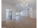 Bright open-plan living room flows into kitchen, featuring wood-look floors at 13305 W Colter St, Litchfield Park, AZ 85340