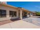 View of the covered patio, backyard, and the home's exterior on a sunny day at 13305 W Colter St, Litchfield Park, AZ 85340