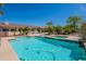 Relaxing backyard pool and spa surrounded by lush landscaping, offering a private oasis at 13305 W Colter St, Litchfield Park, AZ 85340