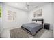 Neutral bedroom with a comfortable bed, stylish rug, and bright natural light at 13629 N 71St Dr, Peoria, AZ 85381