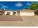 Charming single-story home with a well-maintained landscape and a spacious two-car garage at 13629 N 71St Dr, Peoria, AZ 85381