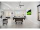 Entertaining game room with a pool table, media, and comfortable seating at 13629 N 71St Dr, Peoria, AZ 85381