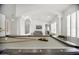 Spacious game room with billiards table and architectural columns creates an inviting atmosphere at 13629 N 71St Dr, Peoria, AZ 85381