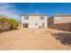 Backyard view featuring the home's exterior, open land, and potential for outdoor activities at 13706 N 130Th Ave, El Mirage, AZ 85335