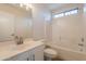 Clean bathroom features a tub-shower combo, a vanity with white cabinets, and bright lighting at 13706 N 130Th Ave, El Mirage, AZ 85335