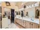 Large bathroom with double sinks, ample counter space, and a walk-in closet at 14680 W Morning Star Trl, Surprise, AZ 85374