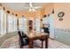 Dining area featuring bright walls, shuttered windows, and tile floors at 14680 W Morning Star Trl, Surprise, AZ 85374