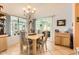 Bright dining room with natural light, stylish furnishings, and patio access at 14680 W Morning Star Trl, Surprise, AZ 85374