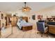 Spacious main bedroom with tile floors, vaulted ceiling, fan, and ample storage at 14680 W Morning Star Trl, Surprise, AZ 85374