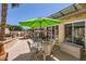 Private patio with a dining table and shade umbrella at 14680 W Morning Star Trl, Surprise, AZ 85374