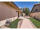 Charming side yard with lush landscaping and walkway at 14680 W Morning Star Trl, Surprise, AZ 85374