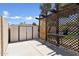 Enclosed backyard featuring a storage shed, shaded pergola, and concrete patio at 14821 N 42Nd St, Phoenix, AZ 85032