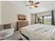 Comfortable bedroom with a view to the outdoors, providing a peaceful atmosphere and ample natural light at 14821 N 42Nd St, Phoenix, AZ 85032