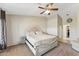 Spacious bedroom featuring a plush bed, soft carpet, and a serene ambiance perfect for relaxation at 14821 N 42Nd St, Phoenix, AZ 85032