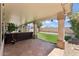 Spacious covered patio with tile flooring, string lights, with an open view of the lawn and backyard at 14821 N 42Nd St, Phoenix, AZ 85032