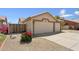Exterior view of a two-car garage with a beautiful bougainvillea at 14821 N 42Nd St, Phoenix, AZ 85032