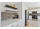Stylish kitchen with white cabinets, stainless steel refrigerator, and modern appliances at 14821 N 42Nd St, Phoenix, AZ 85032