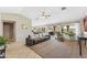 Spacious living room with large windows, tile flooring, and a ceiling fan at 14821 N 42Nd St, Phoenix, AZ 85032