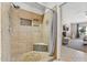 Modern tiled shower with built-in shelves, offering a spa-like experience in a well-designed space at 14821 N 42Nd St, Phoenix, AZ 85032