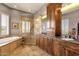 Elegant bathroom featuring a soaking tub, a tiled shower, and custom cabinetry at 15620 E Palomino Blvd, Fountain Hills, AZ 85268