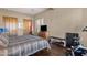 Bedroom featuring hardwood floors, exercise equipment, and two closets at 15620 E Palomino Blvd, Fountain Hills, AZ 85268