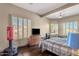 Well-lit bedroom featuring hardwood floors, two closets, and a ceiling fan at 15620 E Palomino Blvd, Fountain Hills, AZ 85268