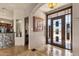 Grand foyer with stone wall accent, patterned flooring, and elegant double door entry at 15620 E Palomino Blvd, Fountain Hills, AZ 85268