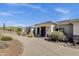 Exterior shot of home with beautiful entry, professional landscaping, and circular driveway at 15620 E Palomino Blvd, Fountain Hills, AZ 85268
