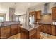 Kitchen with an island, dark countertops, and stainless steel appliances at 15620 E Palomino Blvd, Fountain Hills, AZ 85268