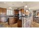 Gourmet kitchen with an island, stainless steel appliances and stone accent wall at 15620 E Palomino Blvd, Fountain Hills, AZ 85268