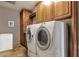 Well-equipped laundry room with large capacity washer and dryer and built-in cabinetry at 15620 E Palomino Blvd, Fountain Hills, AZ 85268