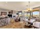 Spacious living area featuring a fireplace, dining space, and breathtaking views at 15620 E Palomino Blvd, Fountain Hills, AZ 85268