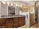 Luxurious bathroom featuring double sinks, a glass enclosed shower, and warm lighting at 15620 E Palomino Blvd, Fountain Hills, AZ 85268