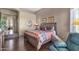 Well-decorated main bedroom featuring dark hardwood floors, comfortable bed, and stone accents at 15620 E Palomino Blvd, Fountain Hills, AZ 85268
