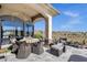 Inviting covered patio with outdoor seating, dining area, and scenic views offers a perfect space for relaxation at 15620 E Palomino Blvd, Fountain Hills, AZ 85268