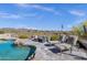 Relaxing pool patio features comfortable lounge chairs, providing a serene outdoor living space at 15620 E Palomino Blvd, Fountain Hills, AZ 85268