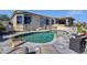 Inviting backyard pool with rock features and lounge chairs offers a relaxing outdoor space at 15620 E Palomino Blvd, Fountain Hills, AZ 85268