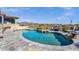 Enjoy the view from this backyard pool and patio with lounge chairs, offering an inviting place to relax at 15620 E Palomino Blvd, Fountain Hills, AZ 85268