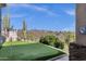 Beautiful backyard putting green with desert views and desert landscaping at 15620 E Palomino Blvd, Fountain Hills, AZ 85268