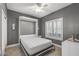 Spare bedroom featuring a Murphy bed, window with shutters, and tile floors at 16232 W Montoya Dr, Surprise, AZ 85374