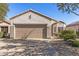 Charming single-story home featuring a tile roof, neutral stucco exterior, and a convenient two-car garage at 16232 W Montoya Dr, Surprise, AZ 85374