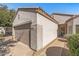 A well-maintained single-story home with a neutral color scheme and a two-car garage at 16232 W Montoya Dr, Surprise, AZ 85374