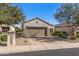 Attractive single-level home with low-maintenance desert landscaping, a tile roof and an attached garage at 16232 W Montoya Dr, Surprise, AZ 85374