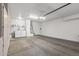 Clean garage featuring white cabinets, laundry area with machines, sink, and storage, offering functionality and organization at 16232 W Montoya Dr, Surprise, AZ 85374