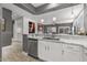 Open kitchen design with stainless steel appliances, bar seating, and bright natural light at 16232 W Montoya Dr, Surprise, AZ 85374