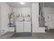 Efficient laundry area with modern appliances, a water heater, a furnace, and shelving for laundry supplies at 16232 W Montoya Dr, Surprise, AZ 85374