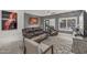 Comfortable living room with tile floors, ceiling fan, and large window at 16232 W Montoya Dr, Surprise, AZ 85374