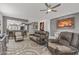 Open-concept living room, seamlessly connecting to the kitchen with barstool seating at 16232 W Montoya Dr, Surprise, AZ 85374