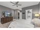 Main bedroom featuring a TV, walk-in closet, and en-suite bathroom at 16232 W Montoya Dr, Surprise, AZ 85374